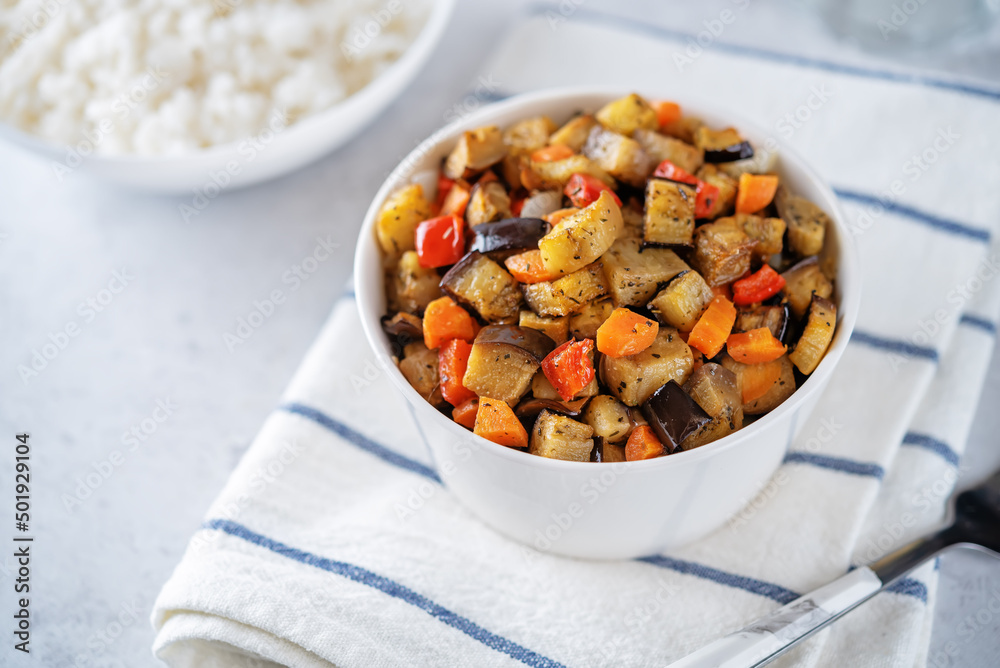 Roasted eggplants with vegetables and rice
