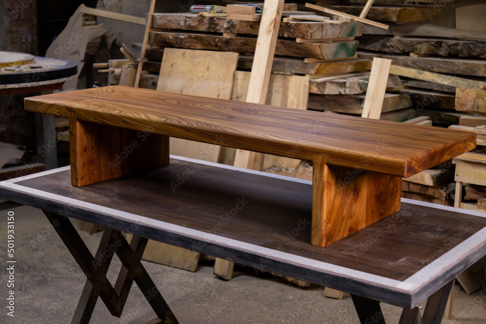 Newly-made brown wooden table in the workshop