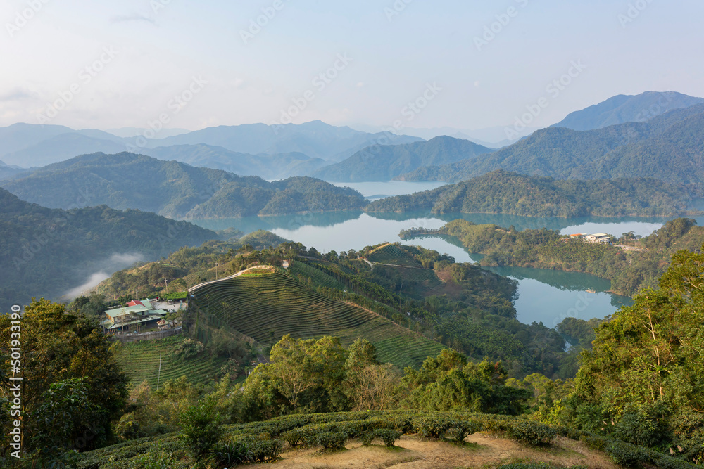 Sunny high angle view of the Feicui Reservoir and tea farm