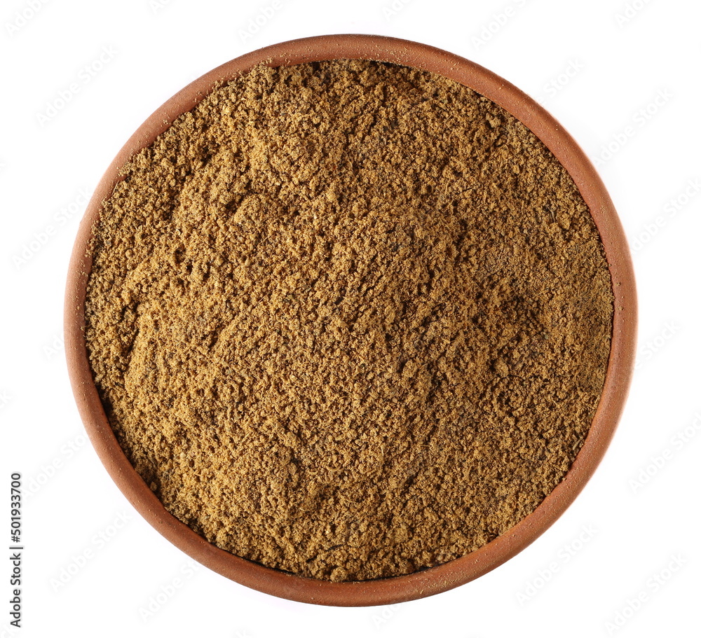Tikka masala spice powder mix, coriander, cumin, garlic, red pepper chili, mint, black pepper and ginger in clay pot isolated on white