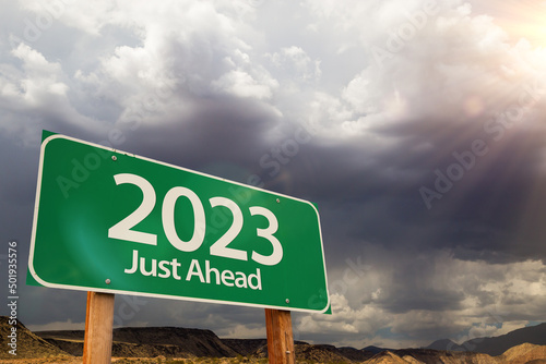 2023 Green Road Sign Over Dramatic Clouds and Sky.