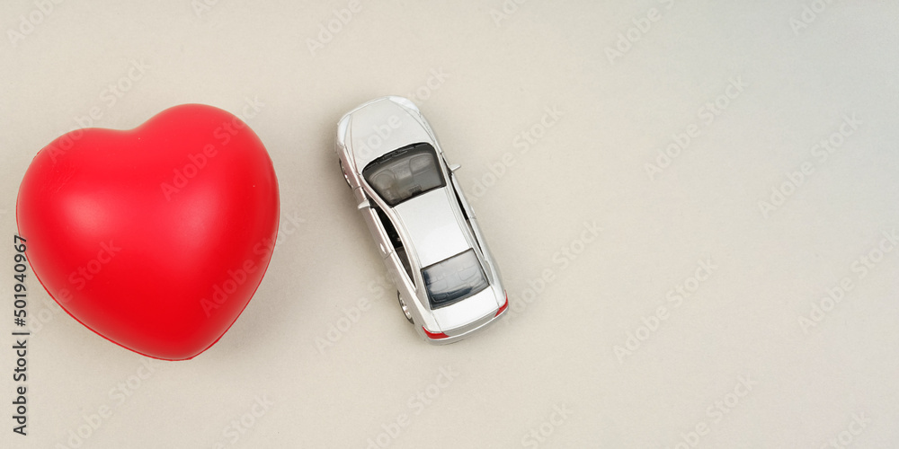 On the gray surface are the heart and the car model. On the gray surface are the heart and the car model.