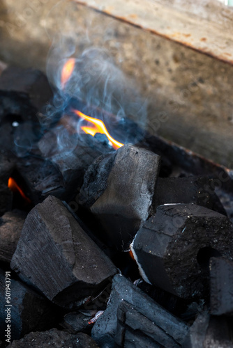 Close up shot of burning wood and charcoal used for barbeque