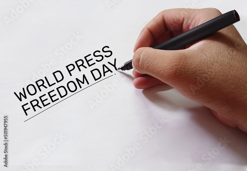 World Press Freedom Day Background with Man Writing On the Paper. The Freedom of press and writing day celebrated around globe in may
