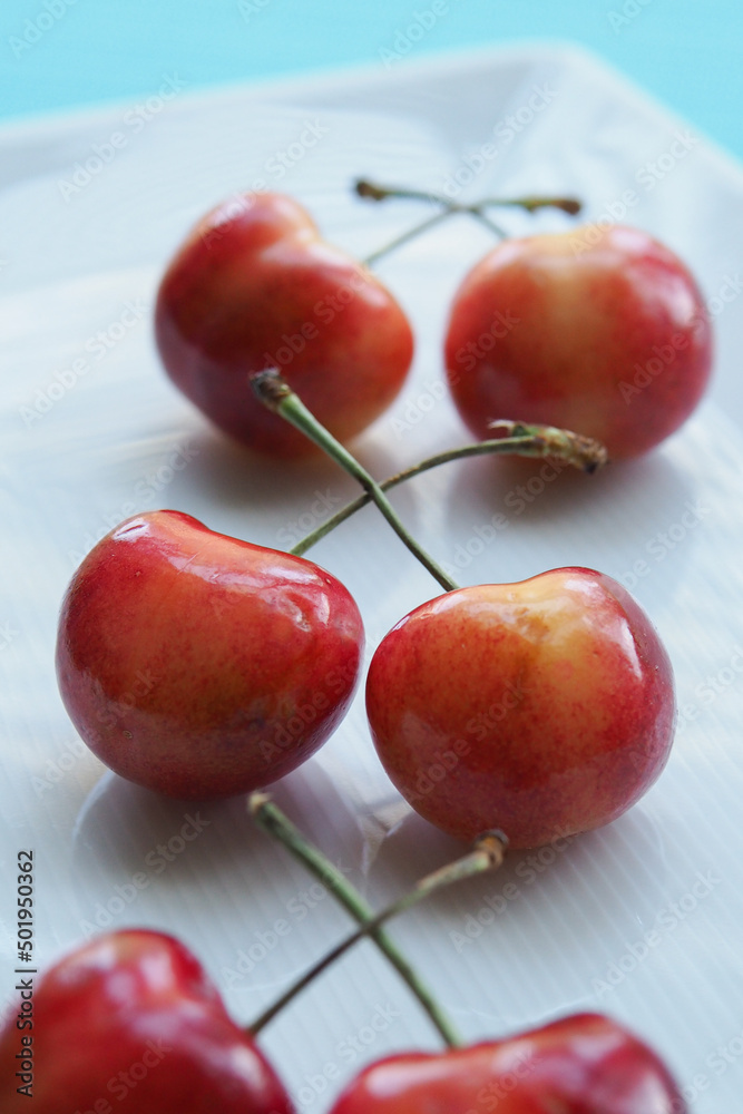 Bunch of Sweet Cherries on White Plate, White Background Bunch of Sweet Cherries on White Plate, White Background