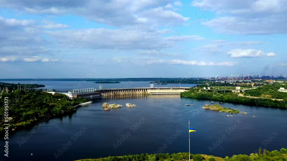dam with running water on the river overlooking the city. Water dam and reservoir producing renewable energy hydroelectric power. Hydroelectric power plant, hydropower. High quality 4k
dam with running water on the river overlooking the city. Water dam and reservoir producing renewable energy hydroelectric power. Hydroelectric power plant, hydropower. High quality 4k