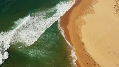 Waterfront line of Tathra beach sand dunes – aerial lifting on Sapphire coast.
 photo