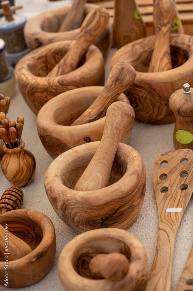 Craft works, olive tree wooden kitchen utensils on farmers market in Provence, France