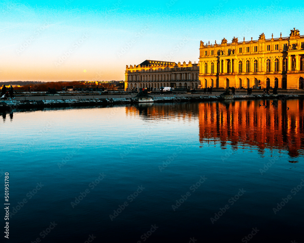 versailles castle in france at sunset with lake in frontersailles castle in france at sunset with lake in front