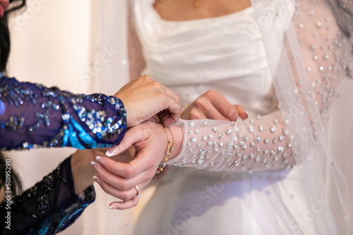 Afghani wedding ceremony traditional gift for a bride, bracelet hands close up