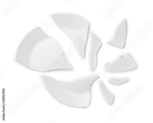 Pieces of broken ceramic plate on white background, top view © New Africa