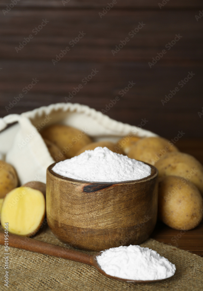 Starch and fresh raw potatoes on table. Space for text Starch and fresh raw potatoes on table. Space for text