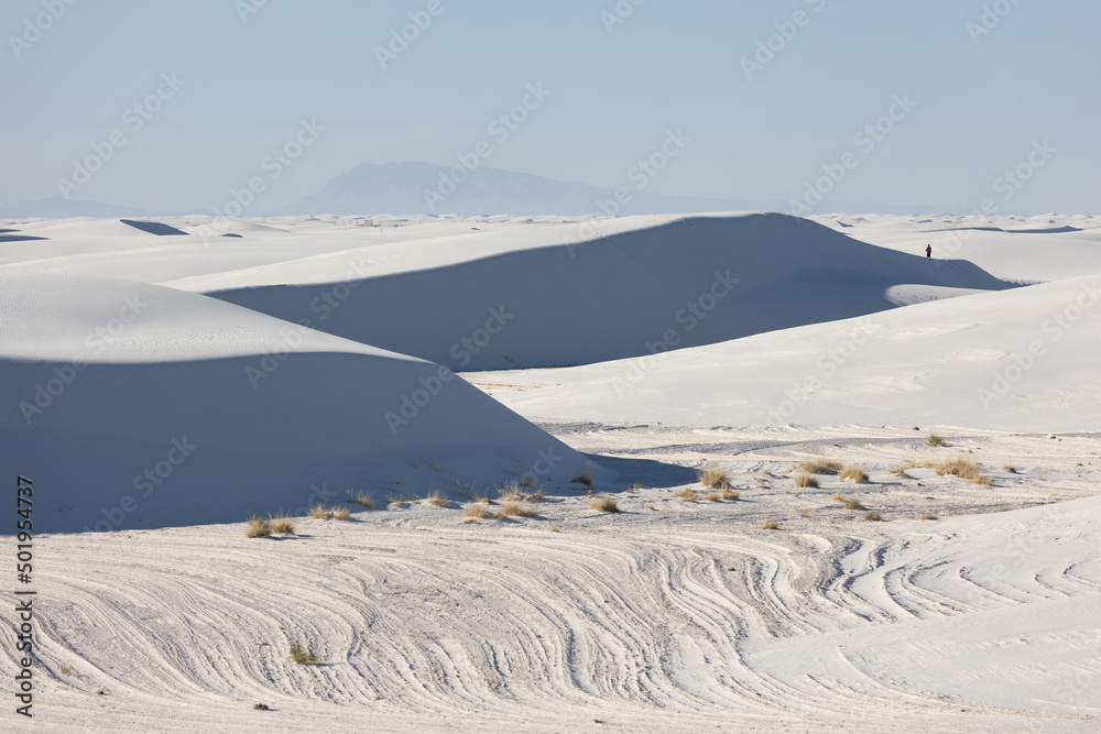 People in the distance on gypsum sand dunes in White Sands National Park