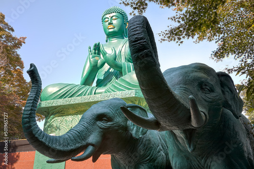 Statues of elephants in front of Great Buddha at Toganji temple. Nagoya. Japan photo