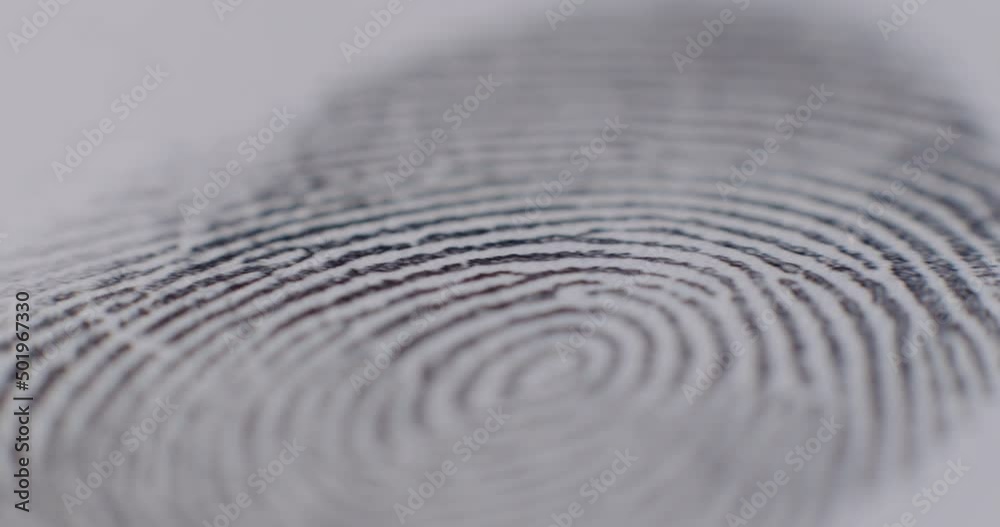 Extreme Close-Up Of Fingerprint Being Applied To Paper With Camera Panning Extreme Close-Up Of Fingerprint Being Applied To Paper With Camera Panning