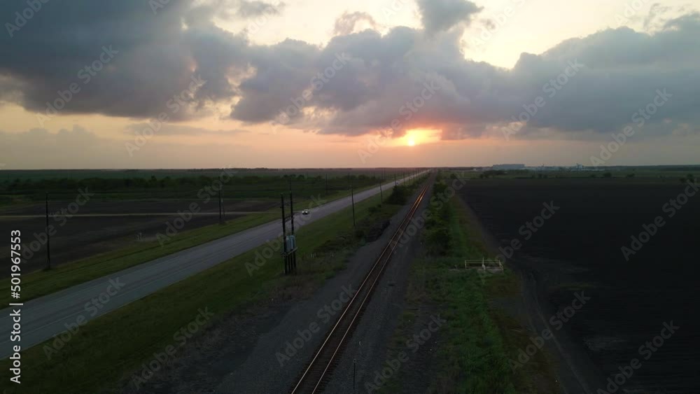 Aerial Shot Over Empty Railroad Tracks At Sunset In Texas, U.S.A. Aerial Shot Over Empty Railroad Tracks At Sunset In Texas, U.S.A.