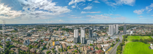 Panoramic aerial drone view of Liverpool in Greater Western Sydney, New South Wales, Australia looking east showing the high rise residential apartments