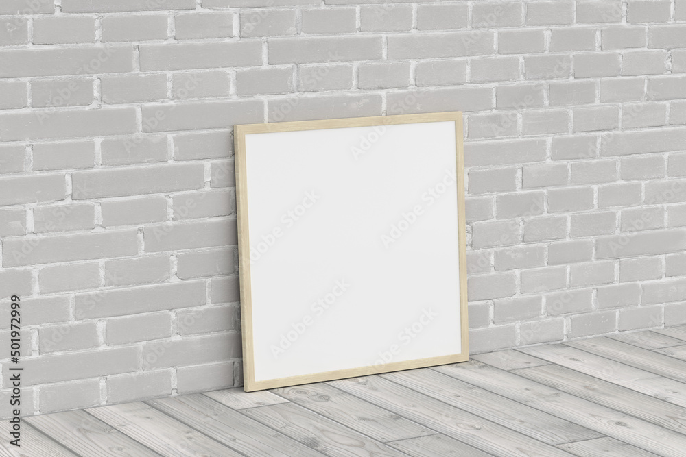Mock up of square wooden frame on the floor with white brick wall. Mock up of square wooden frame on the floor with white brick wall.