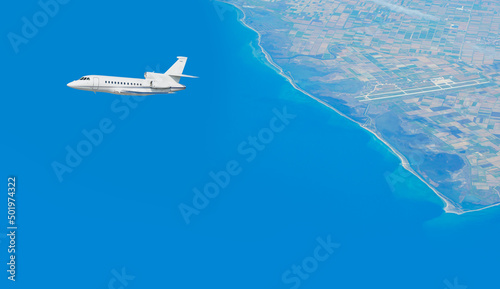 Private airplane taking off from airport - Passenger airplane is flying over amazing mountains and sea  - Travel by air transport © muratart