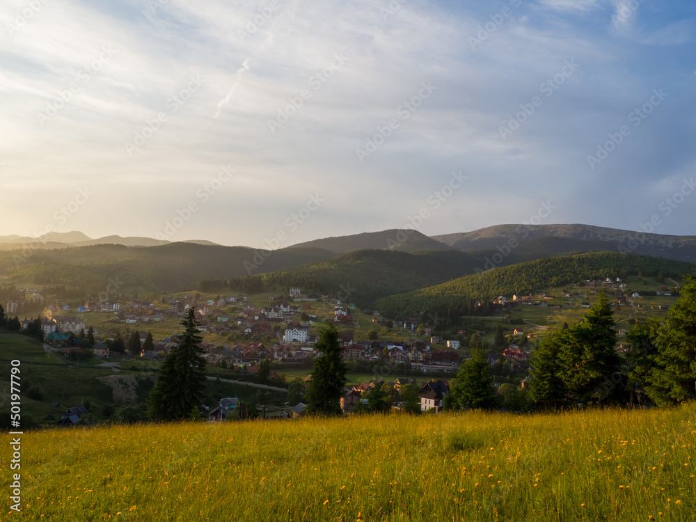 Sunset in Carpathian mountains. Evening in Bukovel, Ukraine. Beautiful natural landscape. Evening light illuminates the valley. Discover the beauty of earth. Sunset in Carpathian mountains. Evening in Bukovel, Ukraine. Beautiful natural landscape. Evening light illuminates the valley. Discover the beauty of earth.