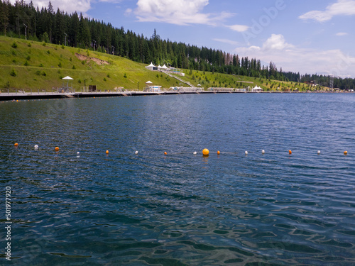 Sights of the modern popular ski resort of Bukovel. Lake of Youth in Bukovel in summer. It is the largest ski resort in Eastern Europe situated in West of Ukraine. 