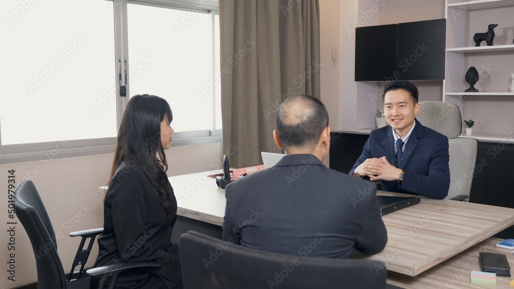 Happy young businessman and businesswoman report explaining project job offer presentation to manager or team leader in office room, businesspeople greeting handshaking with vacancy candidature Happy young businessman and businesswoman report explaining project job offer presentation to manager or team leader in office room, businesspeople greeting handshaking with vacancy candidature