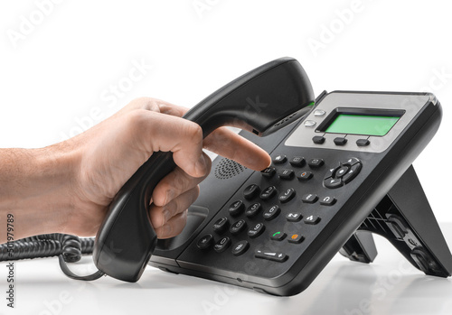 Telephone dialing ,contact and customer service concept. Dialing telephone keypad concept for communication, contact us and customer service support on white background photo