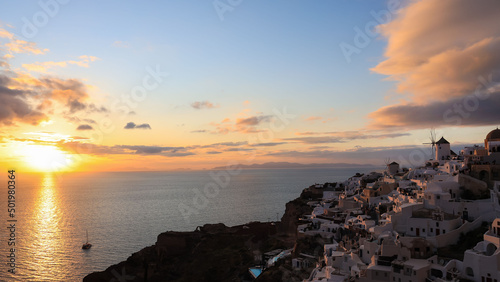 The sunset view of the landmark view in Oia, Santorini. Image of famous village Oia located at one of Cyclades island of Santorini, South Aegean, Greece.