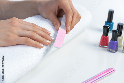 Woman using nail file and create nails shape