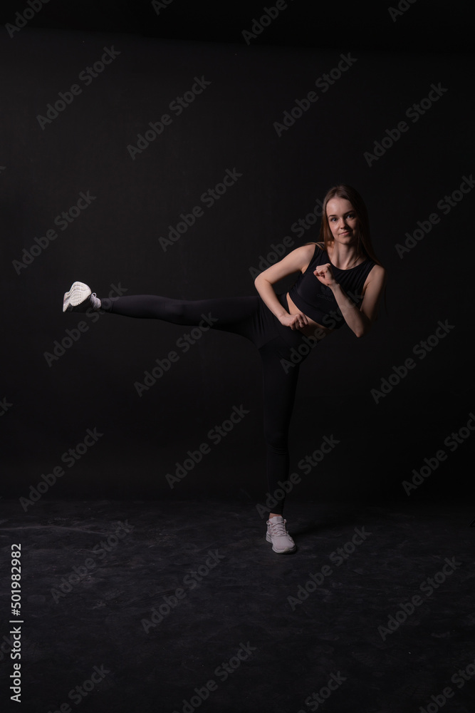 Kicks black A a twine girl background in on karate martial black arts, from blue sitting for kick for action healthy, skill health. Jujitsu leg lifestyle, athlete childhood blow