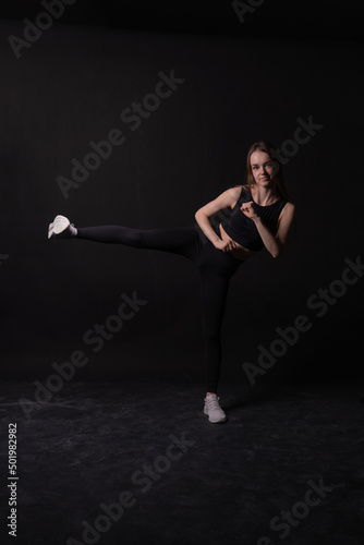 Kicks black A a twine girl background in on karate martial black arts, from blue sitting for kick for action healthy, skill health. Jujitsu leg lifestyle, athlete childhood blow