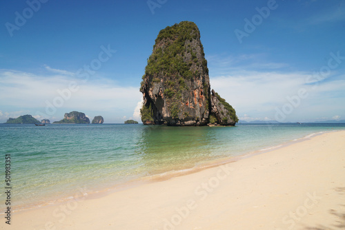 Landscape Traveller on Railay Phranang Beach white sand and blue sea with limestone in Railay Ao nang Krabi Thailand - sunny day summer 