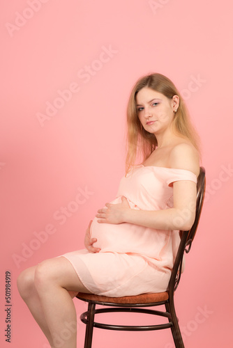 studio portrait of a pregnant woman