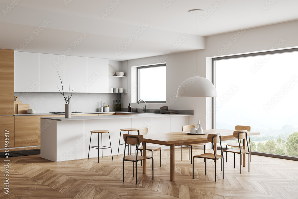 Corner view on bright kitchen room interior with panoramic window Corner view on bright kitchen room interior with panoramic window