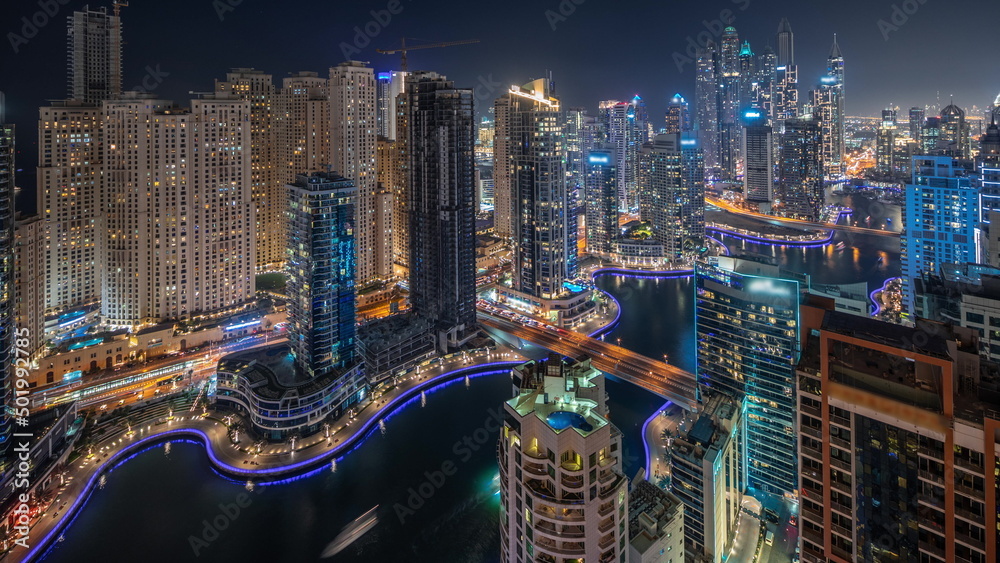 Panorama showing various skyscrapers in tallest recidential block in Dubai Marina aerial night timelapse Panorama showing various skyscrapers in tallest recidential block in Dubai Marina aerial night timelapse