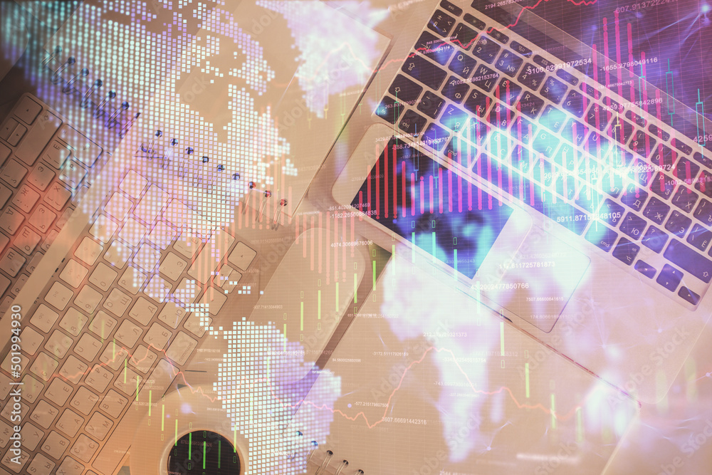 Financial market graph and top view computer on the desktop background. Multi exposure. Investment concept. Financial market graph and top view computer on the desktop background. Multi exposure. Investment concept.