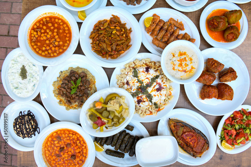 Table scene of assorted take out or delivery foods. Traditional Turkish cuisine. Various Turkish meal and appetizers. Top down view on a table.