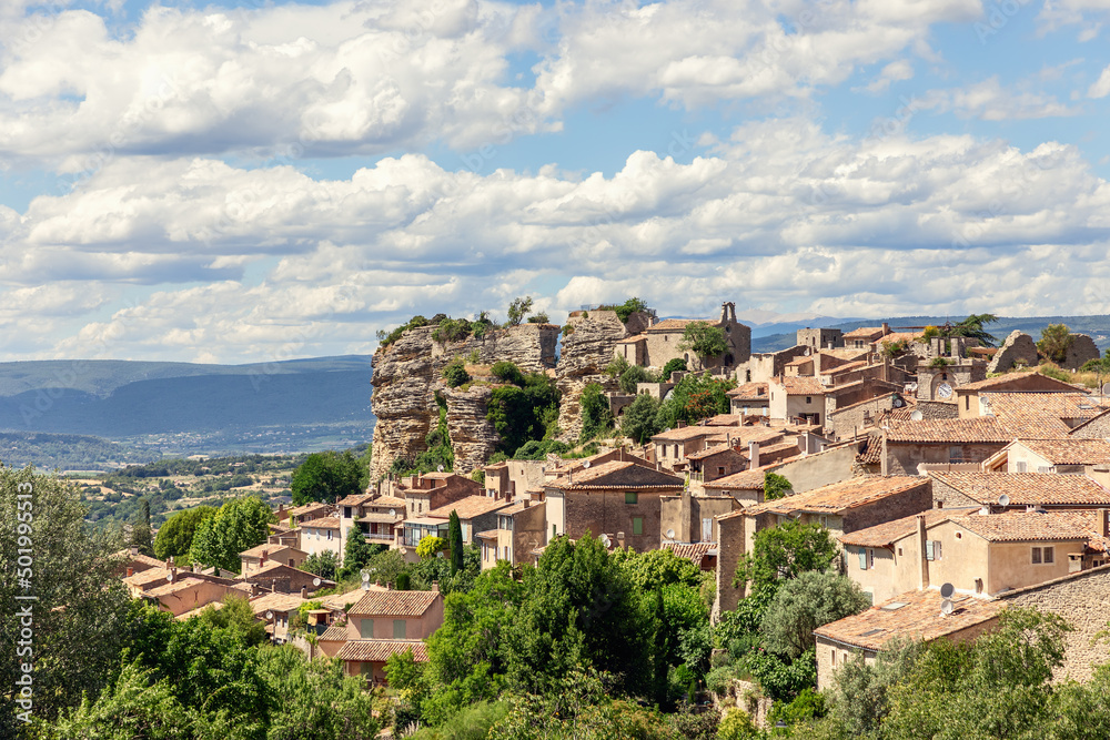 General view of ancient Saignon city on prominent Bellevue rock point over Calavon valley, Vaucluse, Provence, Alpes, Cote d'Azur, France