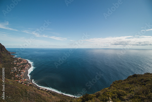 View from the Cabo Girao lookout, the highest cliff in Madeira, of the city of Funchal and the Atlantic Ocean. Aerial view in sunny weather on pure nature