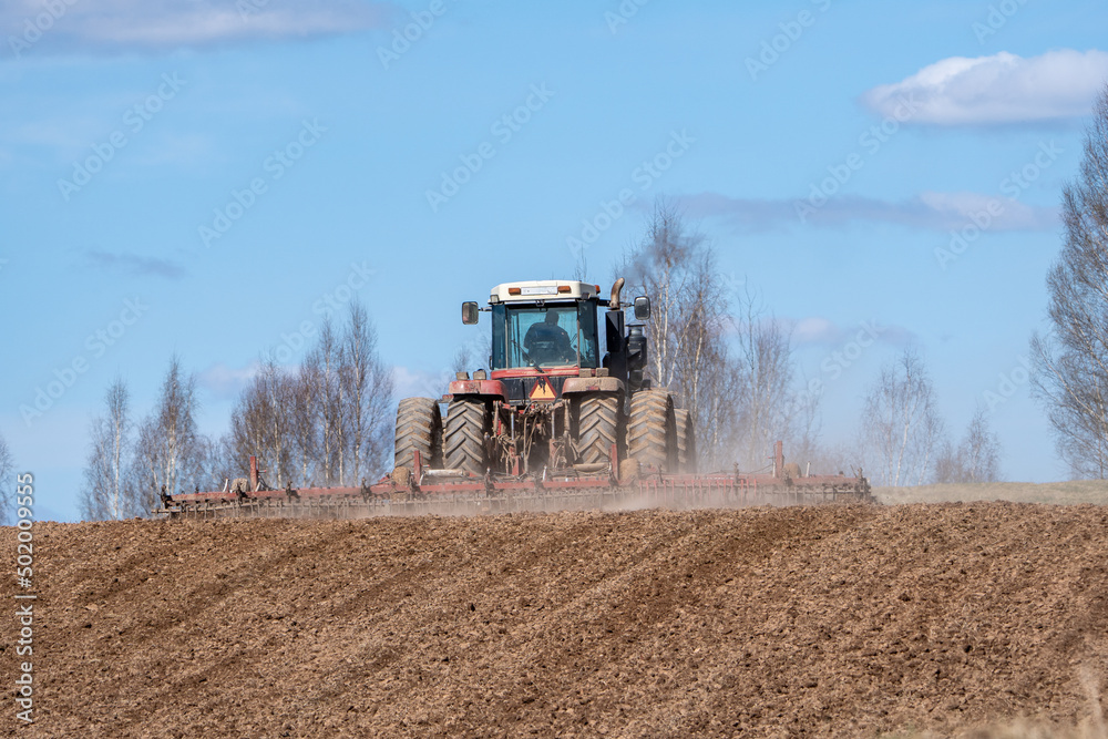 Fototapeta premium tractor in a field from Latvia