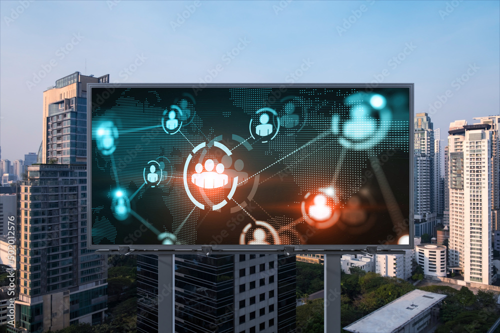 Fototapeta premium World planet Earth map hologram of social media icons over sunset panoramic cityscape of Bangkok, Southeast Asia. The concept of people connections.