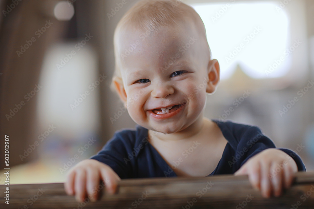 small child is laughing smiling a cheerful kid small child is laughing smiling a cheerful kid