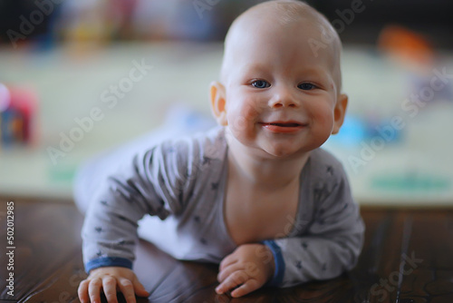 small child is laughing smiling a cheerful kid