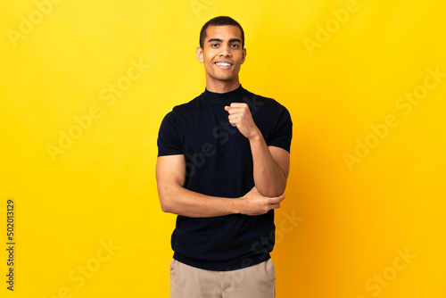 African American man over isolated background laughing