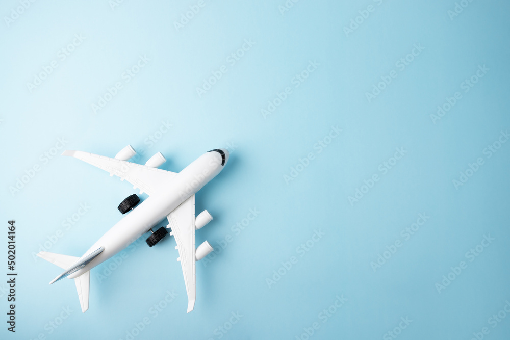 plane and on a blue background, copy space, foreign tours, ticket mobile  application, air ticket booking, travel, tourism and vacation, summer relax,  top view Photos | Adobe Stock
