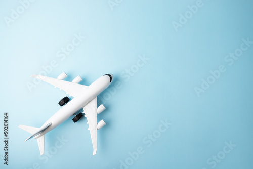 plane and on a blue background, copy space, foreign tours, ticket mobile application, air ticket booking, travel, tourism and vacation, summer relax, top view
