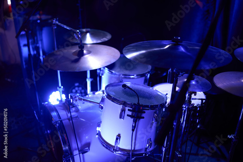 Set of drums. Detail of a drum kit closeup. The concept of a live concert. Drum set on rock concert stage. Professional musical instruments for drummer musician. Drumming instrument on rock festival.