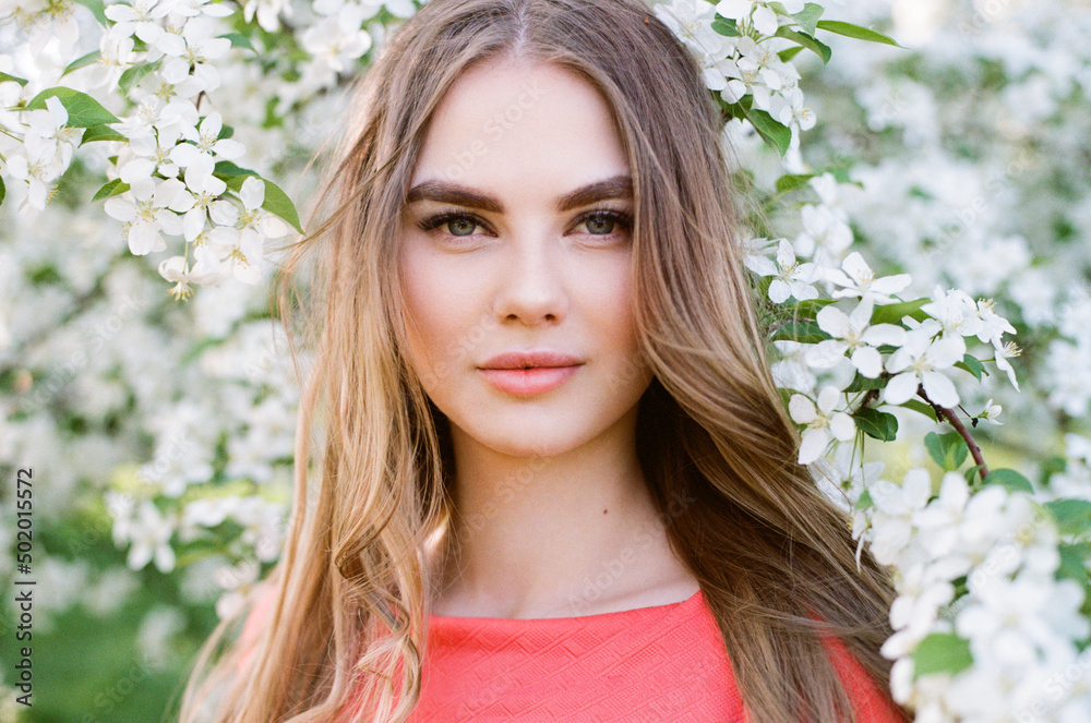 Beautiful young woman in summer garden. Beauty summertime. Film photography Beautiful young woman in summer garden. Beauty summertime. Film photography