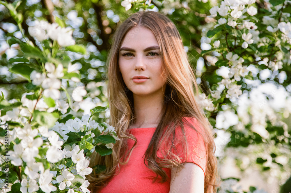 Beautiful young woman in summer garden. Beauty summertime. Film photography Beautiful young woman in summer garden. Beauty summertime. Film photography