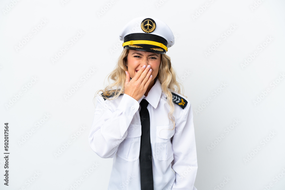 Airplane Brazilian pilot isolated on white background happy and smiling covering mouth with hand Airplane Brazilian pilot isolated on white background happy and smiling covering mouth with hand